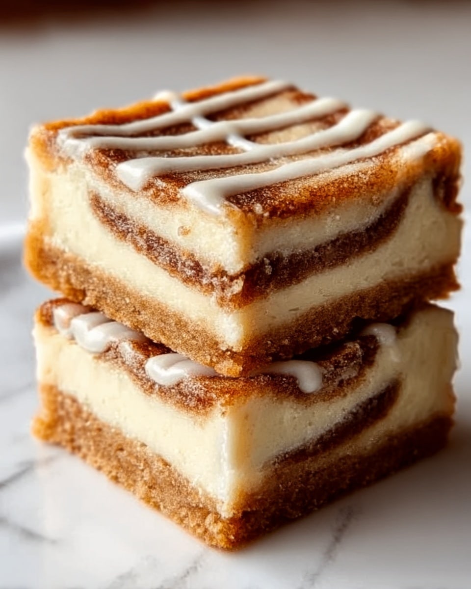 Two square pieces of a dessert stacked on top of each other on a white marbled surface, showing three visible layers inside: a thin light brown crust at the bottom, a thick creamy white layer in the middle, and a swirled cinnamon-brown layer on top with some white icing drizzled over it. The texture looks soft and moist with a slightly crumbly crust and smooth filling, the top layer having a pattern made by the icing. Photo taken with an iphone --ar 4:5 --v 7